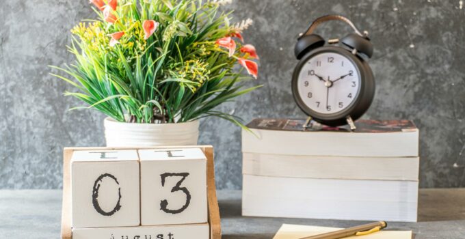 Yellow and Red Flowers on White Wooden Table