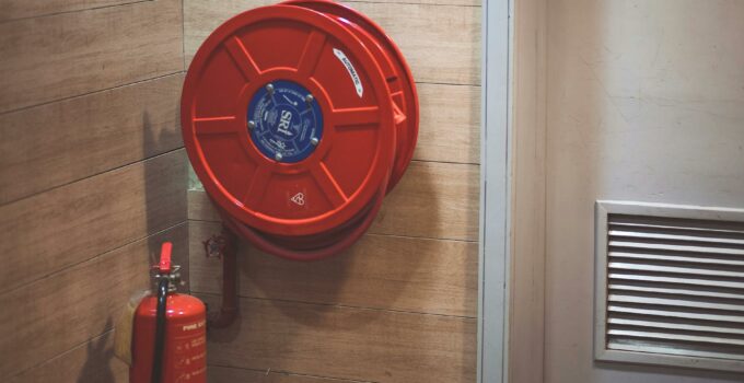 Red Fire Extinguisher below Hose Reel