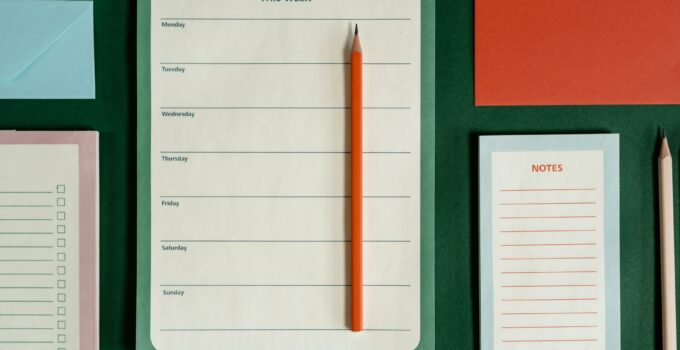 Stationery on Green Surface