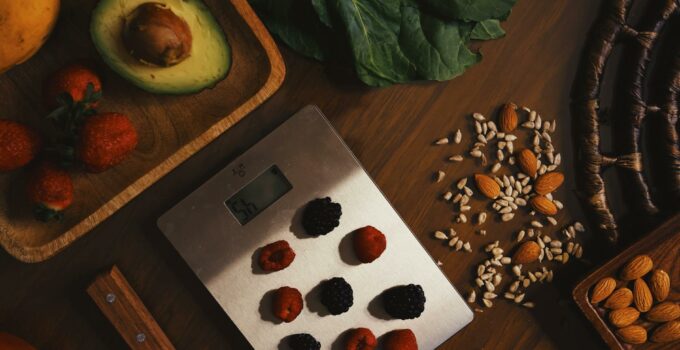 Scales with berries and organic ingredients for recipe