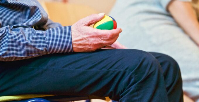 Person Holding Multicolored Ball