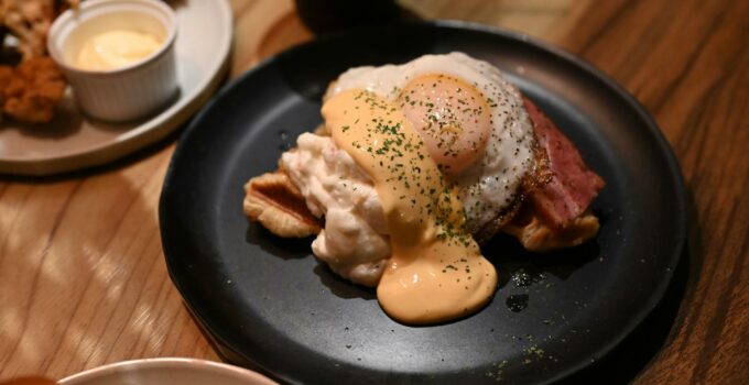 A plate with eggs and bacon on it