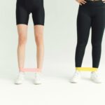 People Workout Using Resistance Bands