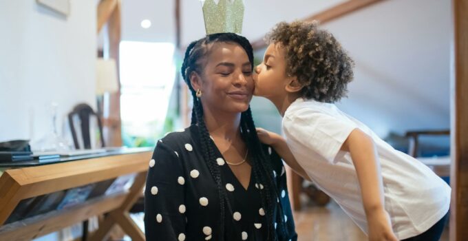 Little Child Kissing Mother in Golden Crown