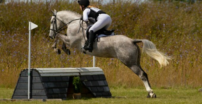 A Female Equestrian Competing in an Event