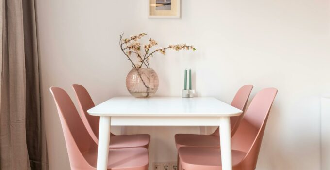 Dining table and pink chairs in light dining room