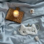 Lighted Candle on the Bed